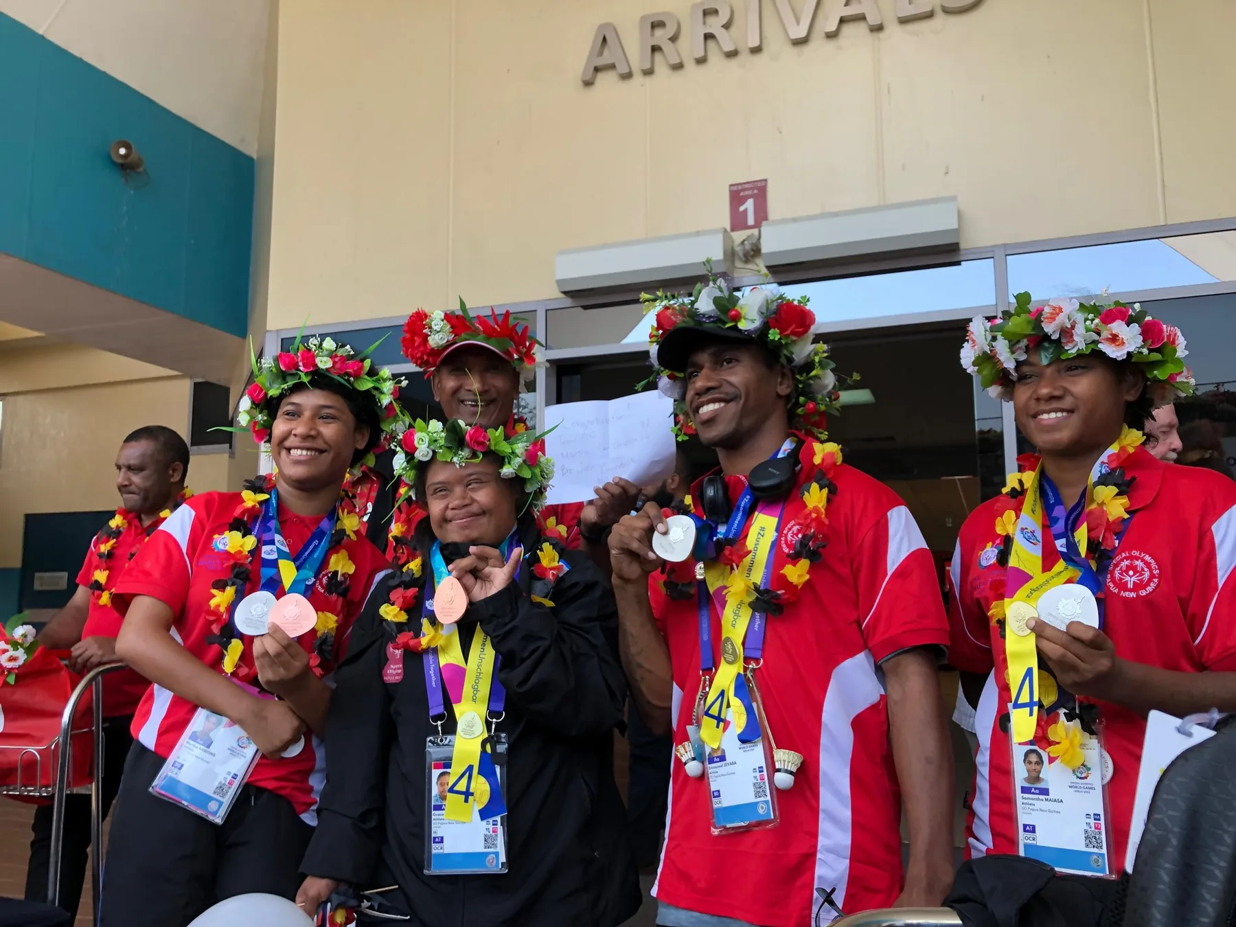 Athletes share a moment during a community gathering