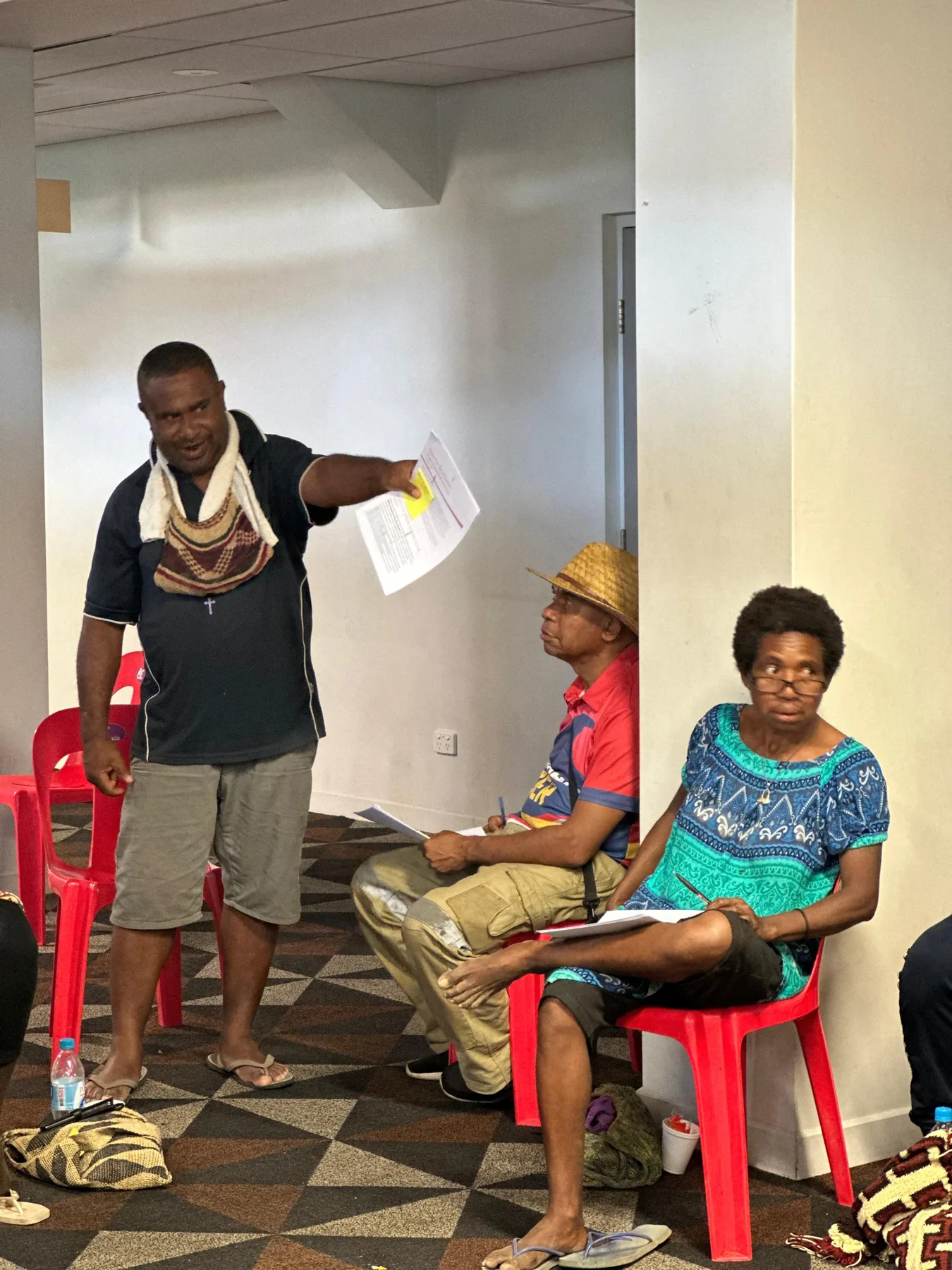 A family member and athlete share a conversation during a support activity