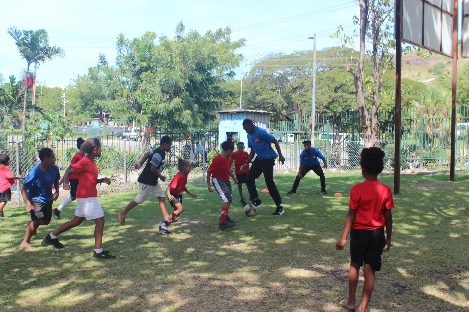 Athletes play football during an inclusive sports activity
