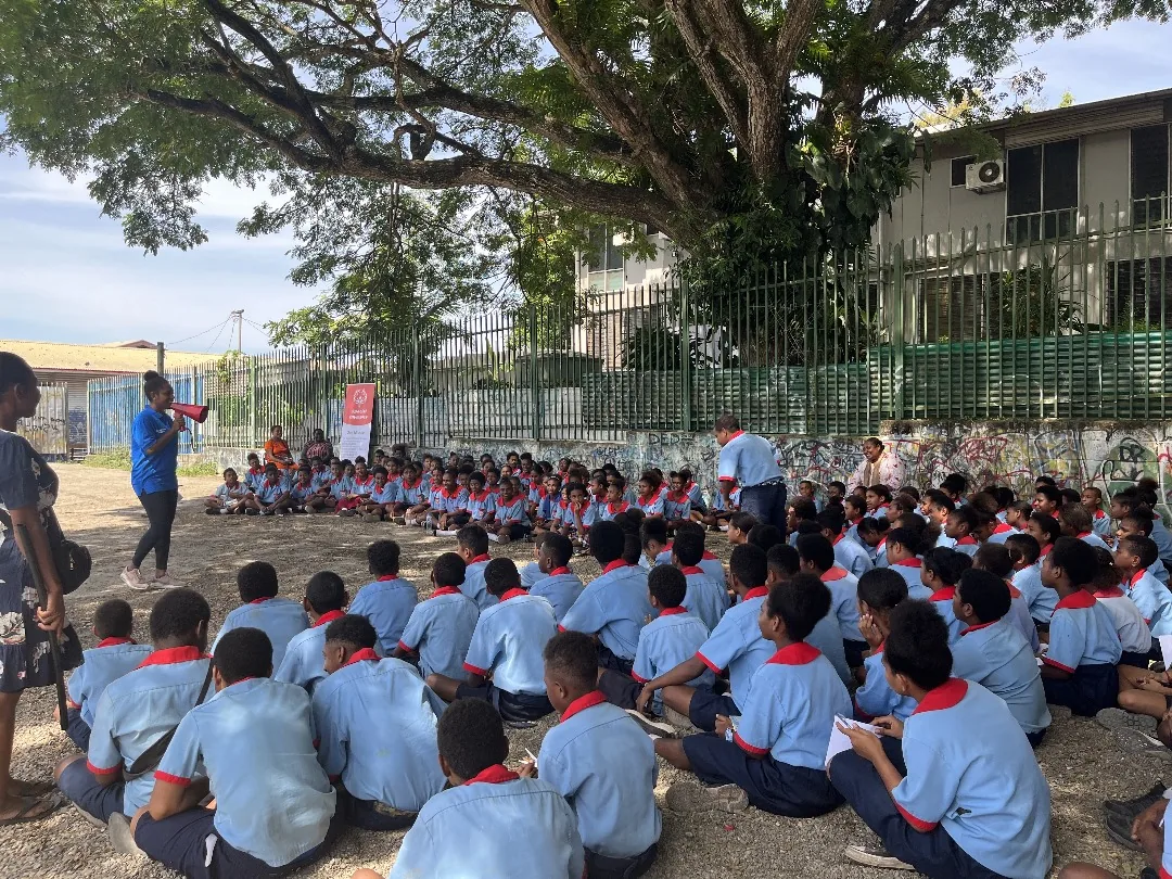 Students gather outdoors during a school visit