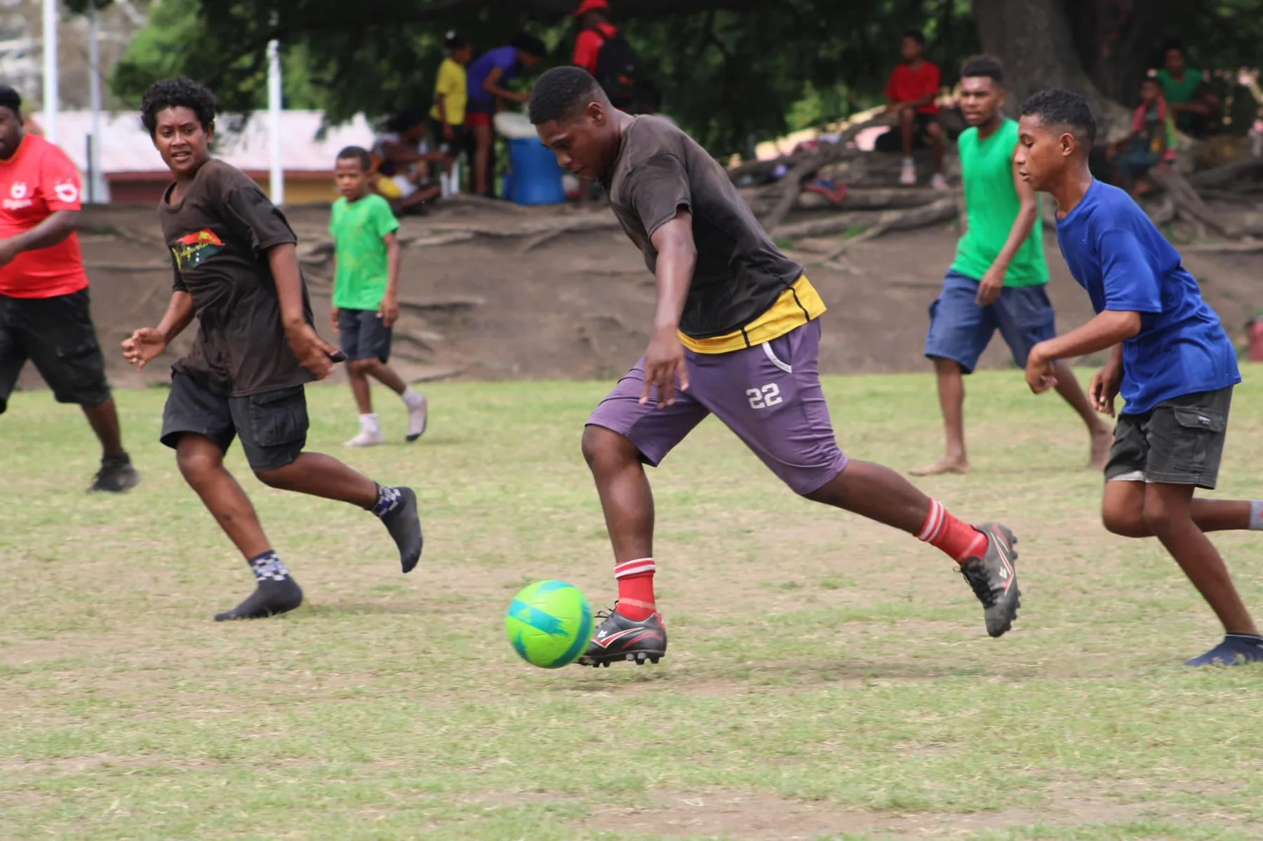 Athletes play football during a Special Olympics competition