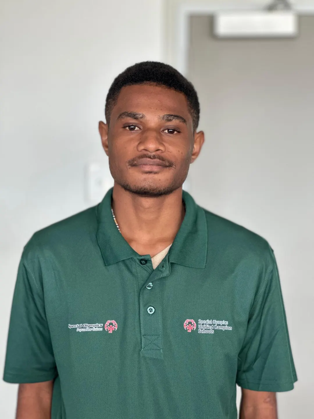 Volunteer portrait; name and position to be added.