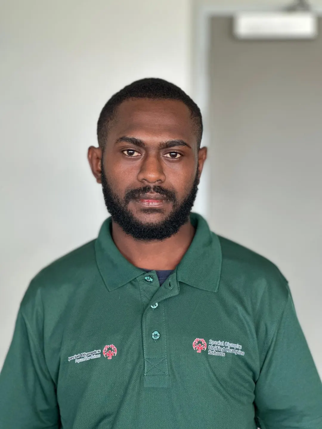 Volunteer portrait; name and position to be added.
